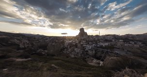 Aerial view of Uchisar castle in the sunset. Cappadocia. Nevsehir Province. Turkey. Timelapse.