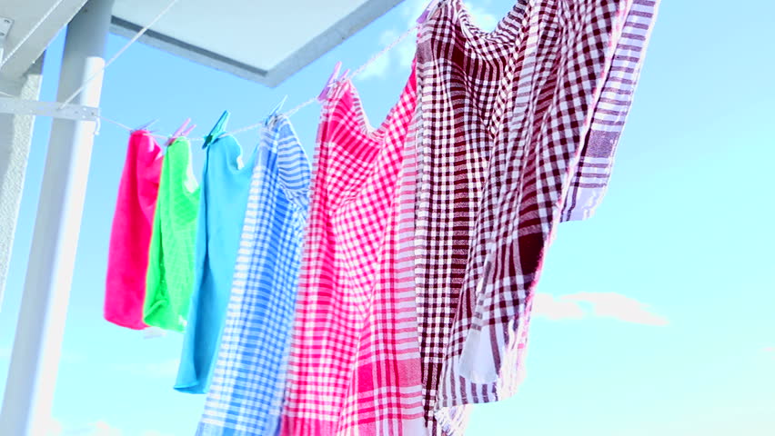 Drying rags on the clothesline. Clean rags hanging on a clothesline