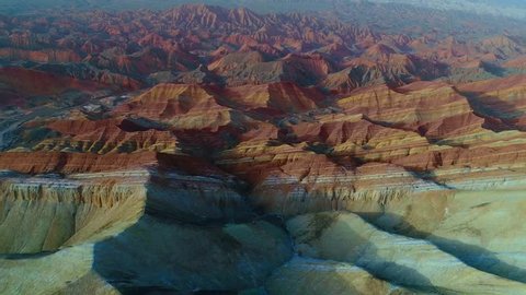 Aerial view on one of the most beautiful sections of Zhangye Danxia Rainbow Mountains showing striped pattern on sandstone hills. Part 2 of a 2 part series which can be merged into a continuous movie.