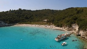 Aerial bird's eye view video taken by drone of tropical paradise seascape in Antipaxos with turquoise and sapphire clear waters, Ionian islands, Greece