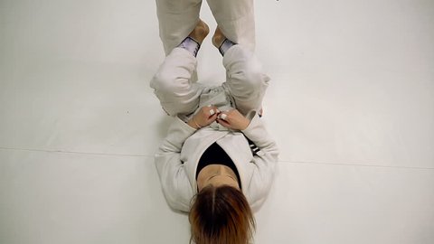 Fight. Girls train for training in judo and jujitsu
