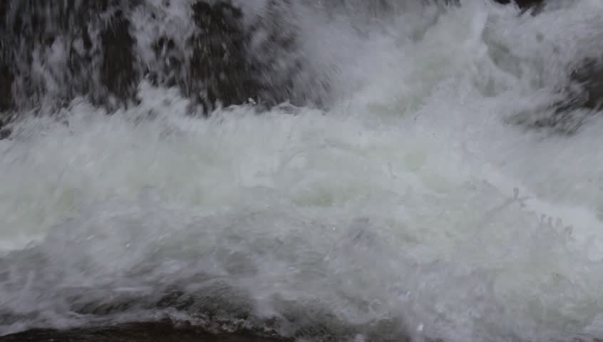 Raging water of the waterfall