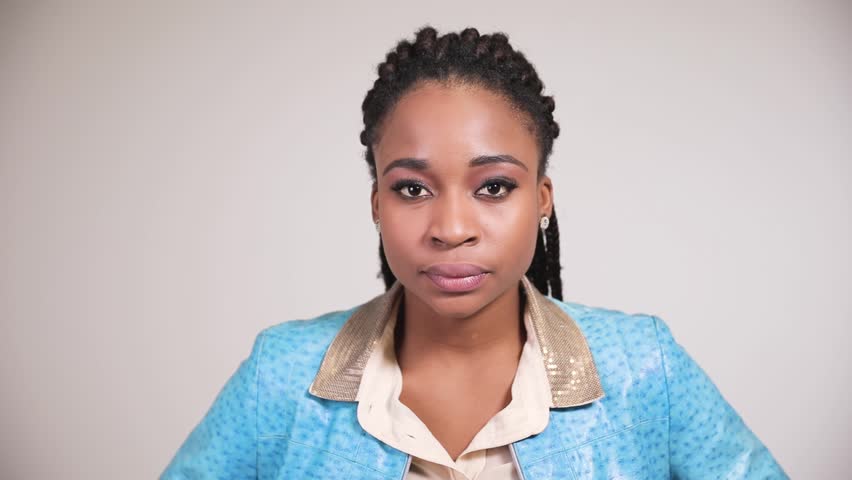 Female afro american person shows disapproval and disagreement emotions.