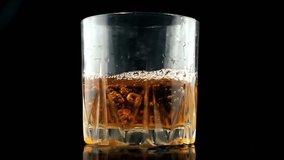 Close-up VIew of Pouring Glass of Soda Drink. Slow Motion Video Clip.