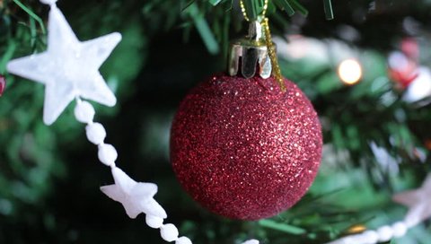 Christmas balls on Christmas tree with lights