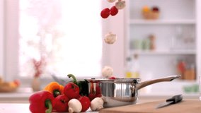 Cherry tomatoes and mushrooms falling in saucepan in kitchen in slow motion - Powered by Shutterstock - Get 15% off with code: PIKWIZARD15