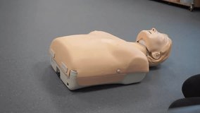 Chest compressions in CPR training.