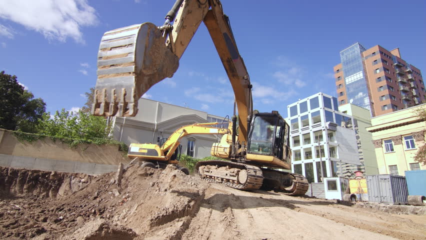 Excavator working on construction site Royalty-Free Stock Footage #33537088