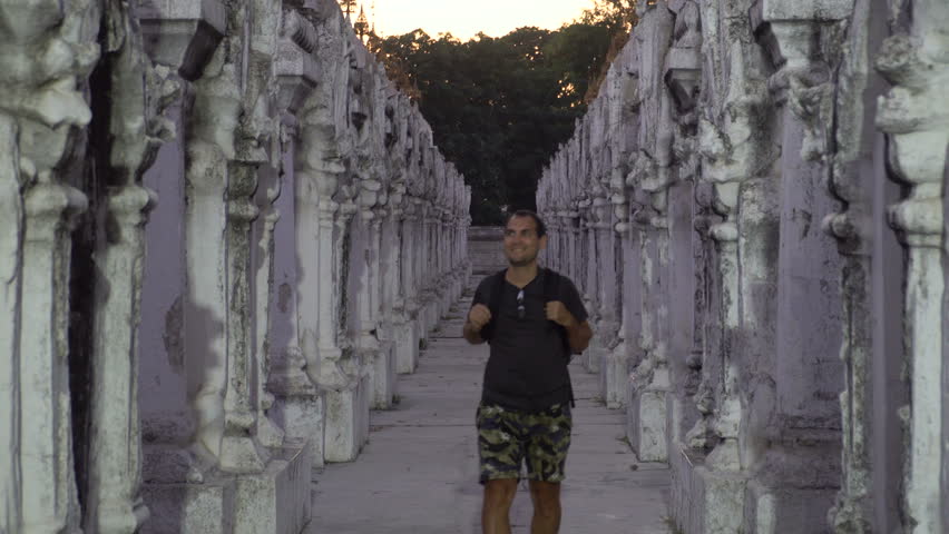 Male Tourist Visiting White Temple in Twilight, Myanmar
