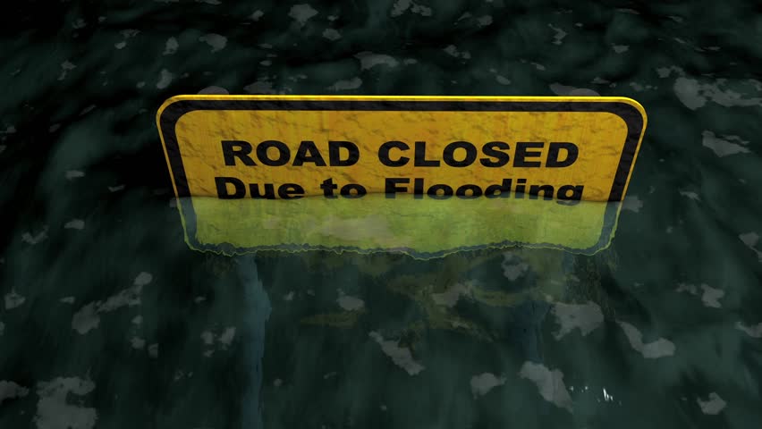 Road closed due to flooding.
