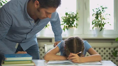 Dad is angry because his daughter don't want to do her homework.