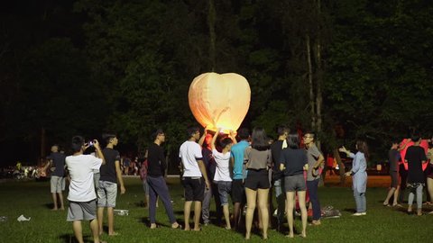 TAIPING, MALAYSIA - 4 October 2017: Group Of Malaysia Chinese Teenager Releasing Chinese Lanterns Into The Air During Mid-Autumn Festival