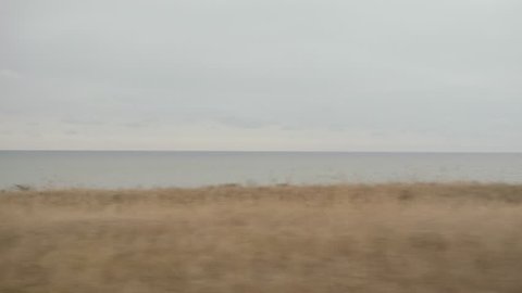 Landscape outside the car window. Travel by car along the sea coast