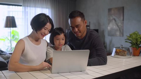 Asian family using the computer.