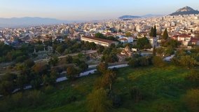 Aerial bird's eye view video taken by drone of iconic Ancient Agora, Athens historic center, Attica, Greece