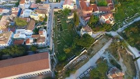 Aerial bird's eye view video taken by drone of iconic Ancient Agora, Athens historic center, Attica, Greece