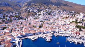 Aerial birds eye view video taken by drone from port of pictruesque island of Hydra, Saronic gulf, Greece