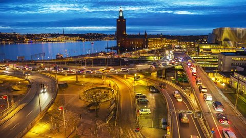 Time lapse of intense traffic in central Stockholm. In the backdrop, the famous City Hall
