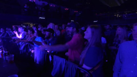 Park City, Utah, March 2017.   Audience dancing to bluegrass, folk, country music, jam band the Infamous Stringdusters performing at Park City Live concert venue located on Main Street.  
