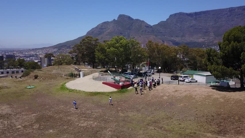 4K high quality aerial video scenic view of Signal Hill, Cape Town city center bowl with view of Table Bay, football stadium and Table Mountain in the background in Cape Town, South Africa on sunny da