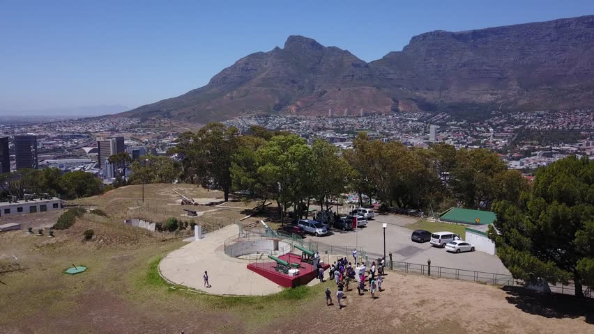 4K high quality aerial video scenic view of Signal Hill, Cape Town city center bowl with view of Table Bay, football stadium and Table Mountain in the background in Cape Town, South Africa on sunny da