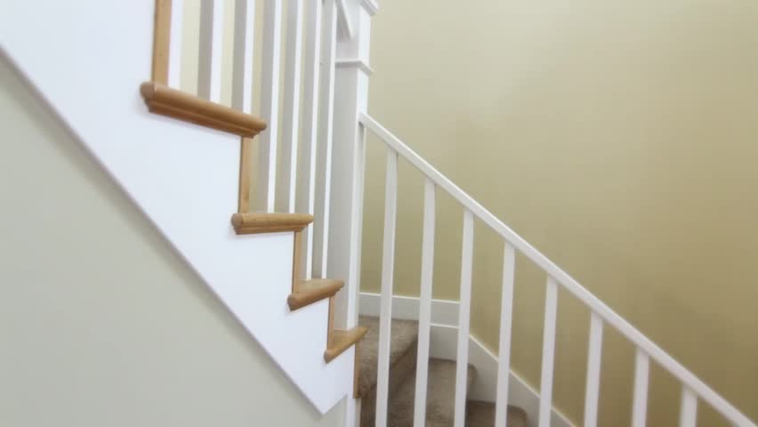 A jib shot of a stairwell in a new house