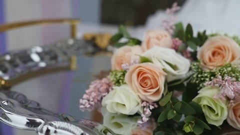 Bride bouquet of flowers, Beautiful bridal bouquet on the table, groom boutonniere, Wedding day, Bride's bouquet. wedding preparations, videoclip de stoc