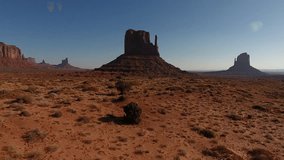 Dynamic panoramic footage of exciting Monument valley scenery.Aerial video from drone flying between high brown rocks