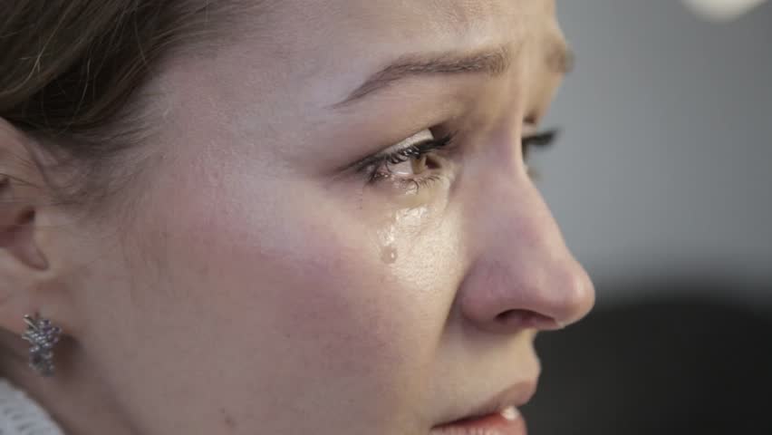 disappointment woman with brown eyes crying, wipes away tears with a paper handkerchief Royalty-Free Stock Footage #33603940