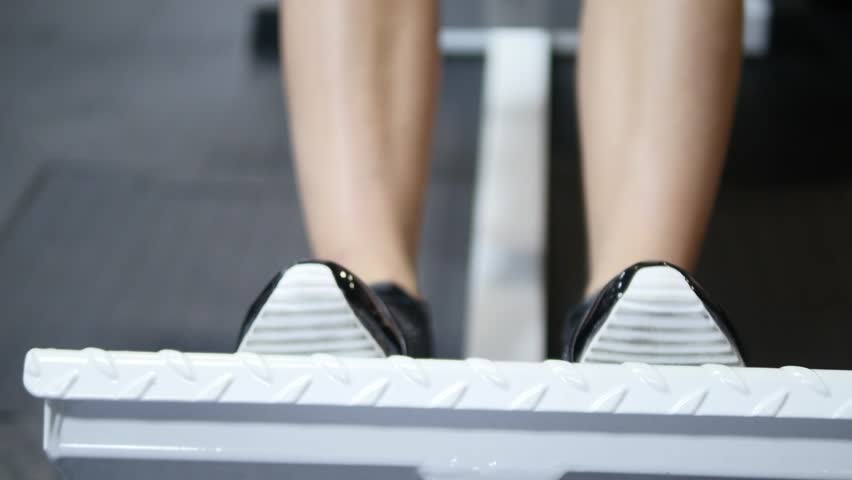 legs of a young woman who trains at the gym
