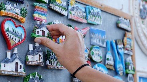 Alberobello, Italy,7 August 2017- choosing the Trulli's magnets for the refrigerator, alberobello souvenirs