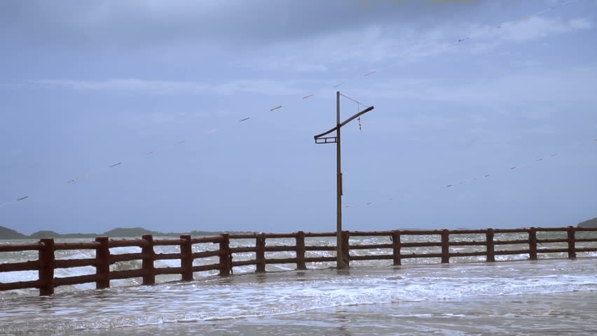 Giant Sea Waves Fall on Waterfront. Slow Motion