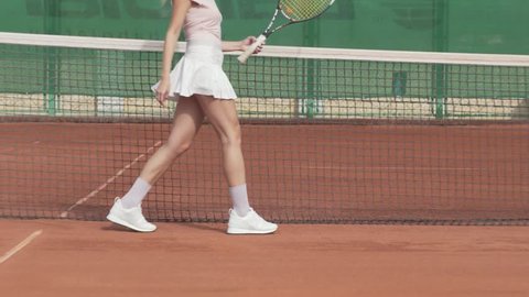 Sexy tennis woman posing at the camera