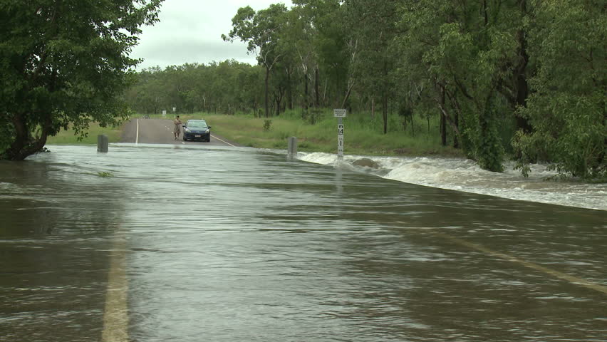 DARWIN, AUSTRALIA - FEBRUARY 2011. Car Drives Through Flooded Road - Full HD
