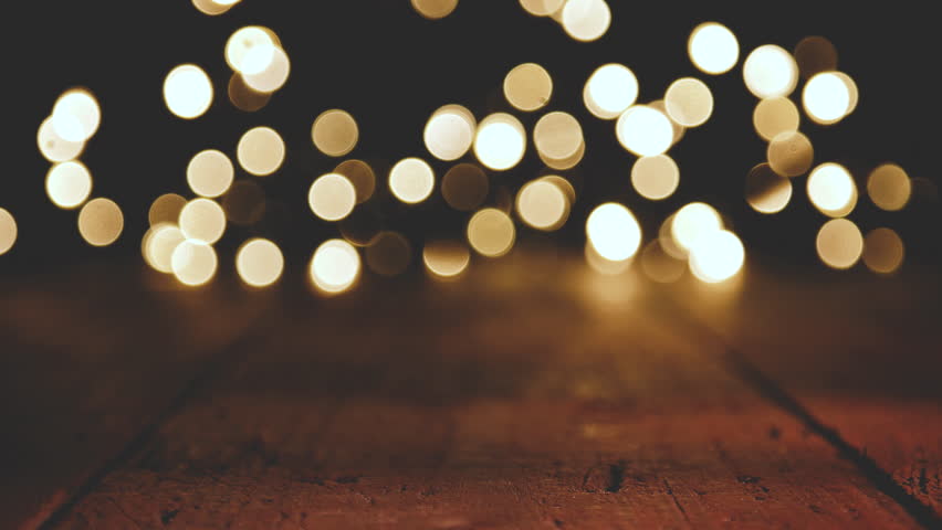 Circular reflections of Christmas lights Bokeh with wooden board Background | Shutterstock HD Video #33621511