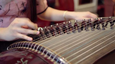 playing Chinese zither