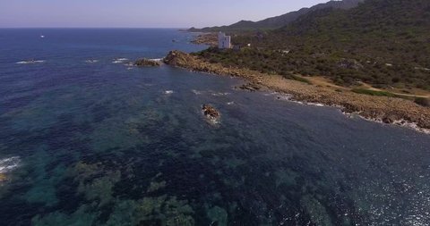 Aerial, rocky coast in Capo Comino in Sardinia island and incredibly beautiful sea