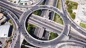Aerial bird's eye video taken by drone of highway and ring road passing through city center