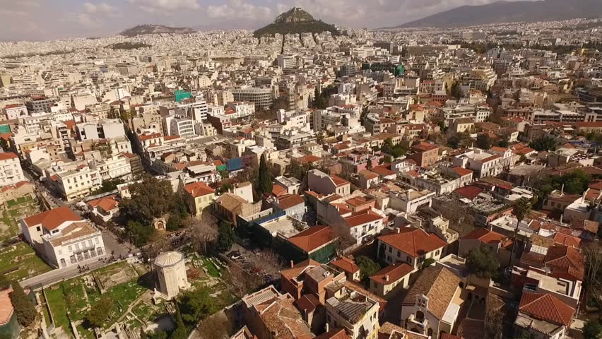 Aerial birds eye view photo taken by drone of iconic archaeological sites in Plaka district, Athens historic center, Attica, Greece