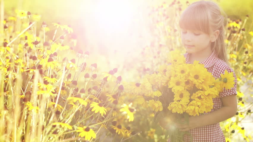 Sunny Girl with yellow flowers. Lens flares