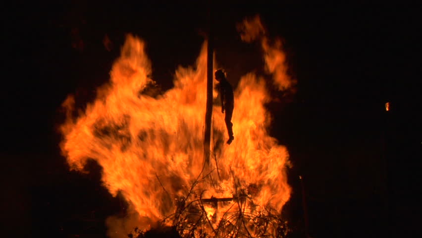 A puppet of an old witch is burnt on a bonfire