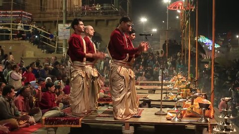 VARANASI, INDIA - JANUARY 25, 2017 : Unidentified Hindu priest at the religious Ganga Aarti ritual, fire puja, at Dashashwamedh Ghat in Varanasi, Uttar Pradesh, India