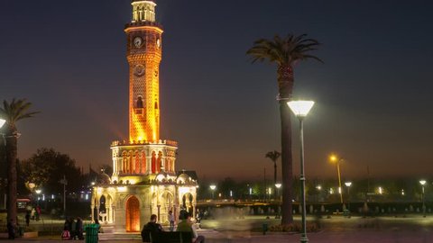 People near clock tower of Izmir at evening timelapse, Turkey