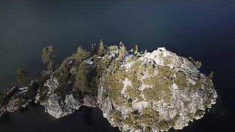 Drone flys over fannett island emerald bay lake tahoe california slowly looking down and to the left