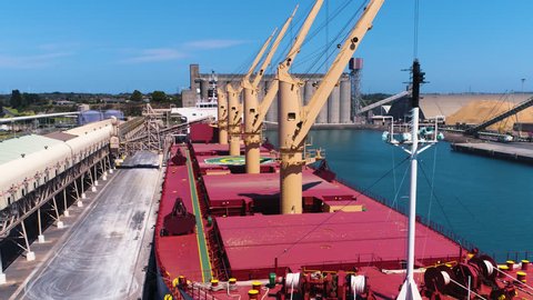 Drone shot of unidentified ship loading export grain in an Australian port