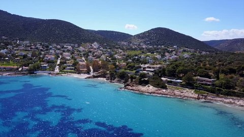 Aerial bird's eye video taken with drone of famous bay and port of Porto Rafti with turquoise clear waters, Mesogeia, Attica, Greece