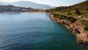 Aerial bird's eye view video taken by drone of clear water seascape of Avlaki, Porto Rafti, Mesogeia, Attica, Greece