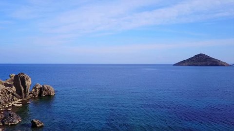 Aerial bird's eye video taken with drone of famous seascape in Porto Rafti with turquoise clear waters, Mesogeia, Attica, Greece