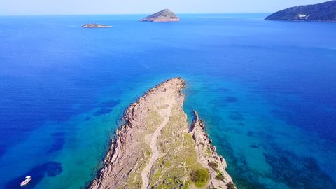 Aerial bird's eye video taken with drone of famous seascape in Porto Rafti with turquoise clear waters, Mesogeia, Attica, Greece