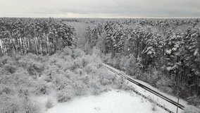 Aerial view of thr road with snow-covered pine branches